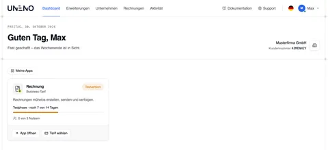 Das Dashboard mit der Kopfzeile (Dashboard, Erweiterungen, Unternehmen, Rechnungen, Aktivität, Dokumentation, Support), der Begrüßung „Guten Morgen, Max“ mit Musterfirma GmbH und Kundennummer rechts und der App-Karte „Rechnung“ unter „Meine Apps“ – Business-Tarif, Testversion, noch 7 von 14 Tagen, 2 von 3 Nutzern, mit App öffnen und Tarif wählen.
