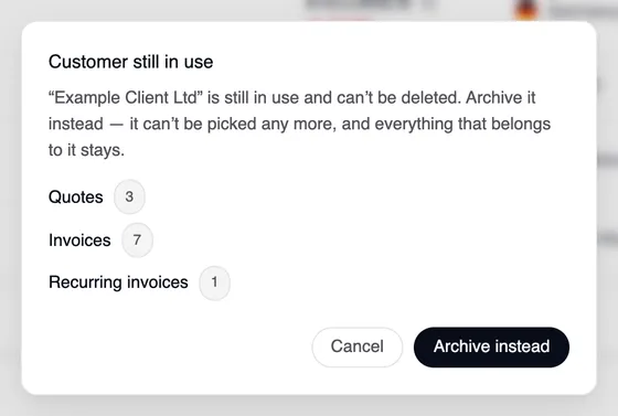 The window “Customer still in use”: “Example Client Ltd” is still in use and can't be deleted — Quotes 3, Invoices 7, Recurring invoices 1. With “Cancel” and “Archive instead”.