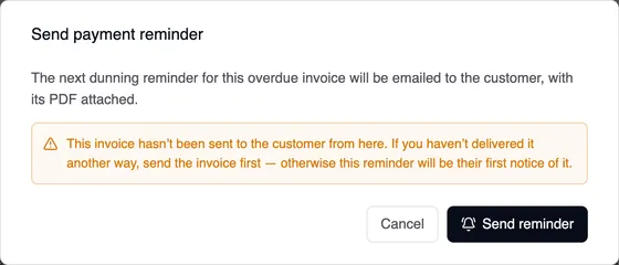The “Send payment reminder” window: The next dunning reminder for this overdue invoice will be emailed to the customer, with its PDF attached. Below it, in orange, a note that the invoice hasn't been sent to the customer from here. Cancel and Send reminder buttons.