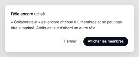 La fenêtre « Rôle encore utilisé » : « Collaborateur » est encore attribué à 2 membres et ne peut pas être supprimé. Attribuez-leur d’abord un autre rôle. En dessous, « Fermer » et « Afficher les membres ».