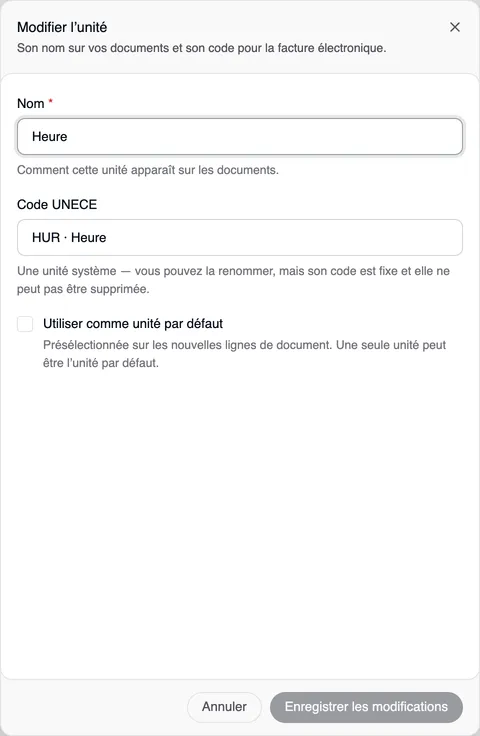 La fenêtre « Modifier l’unité » pour Heure : le champ Nom est modifiable, le code UNECE « HUR · Heure » est fixe, en dessous « Une unité système — vous pouvez la renommer, mais son code est fixe et elle ne peut pas être supprimée. », puis la case « Utiliser comme unité par défaut », Annuler et « Enregistrer les modifications ».